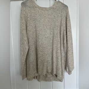 Woman’s plus size cream sweater